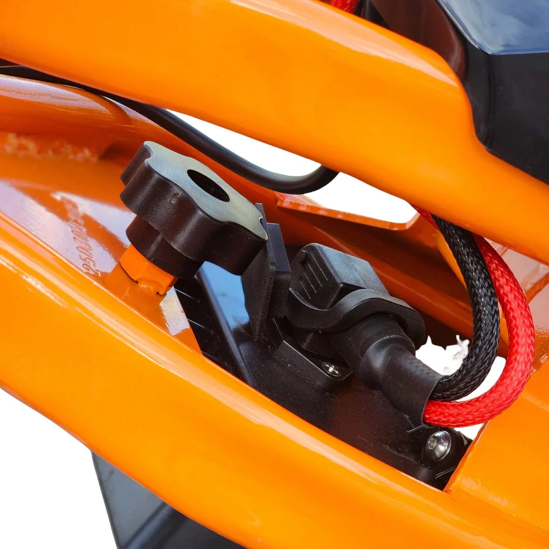 Close-up of a motorcycle's front suspension system with orange frame