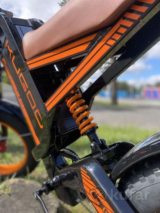 Close-up of a Kugoo electric bike with a blurred background