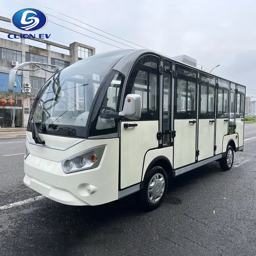 Electric bus on a road with 'CCION EV' branding.