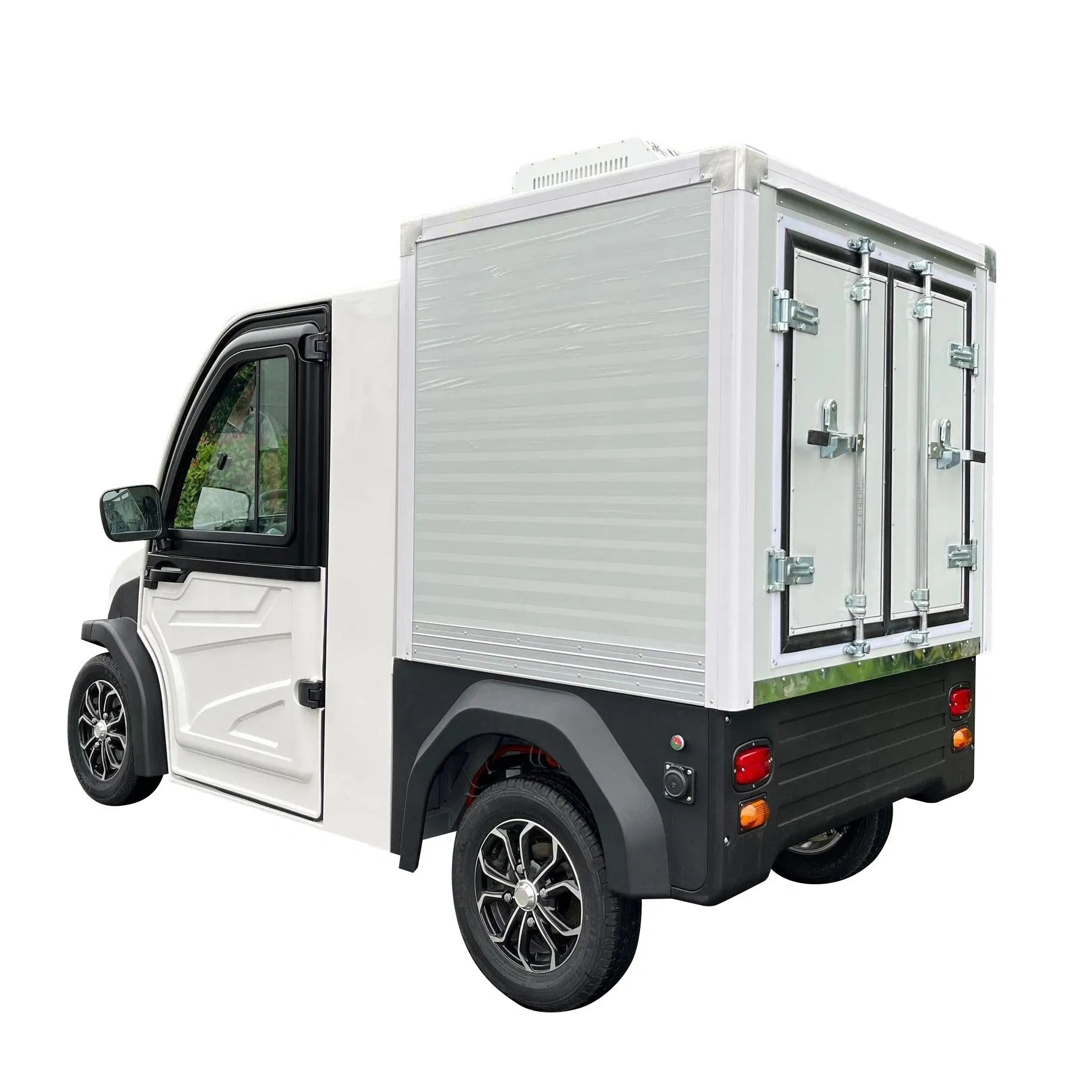 ocean cartz rear three-quarter studio shot of a white electric refrigerated delivery vehicle with an enclosed cab, set against a white background. This compact electric NEV or refrigerator work cart features a silver insulated rear cargo box with double doors and a top-mounted refrigeration unit. The vehicle has black fender flares and custom black and silver wheels, highlighting its use for cold chain last-mile delivery.