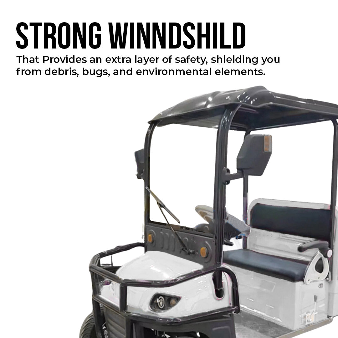 ocean cartz promotional image highlighting the strong windshield of a white utility electric vehicle with a flatbed. The shot shows the driver area with a black roof, front brush guard, and black seats. Text on the image emphasizes the windshield as an extra layer of safety, shielding from debris, bugs, and environmental elements, promoting this key safety feature of the work cart.