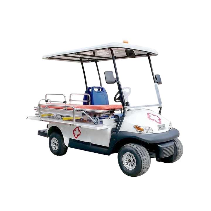ocean cartz studio shot of a white electric ambulance golf cart or medical utility vehicle with a white roof, set against a pure white background. This emergency response cart is equipped with a stretcher or patient transport bed in the rear, surrounded by chrome safety rails. A red cross medical logo is visible on the side and front hood, highlighting its specialized rescue golf cart function.