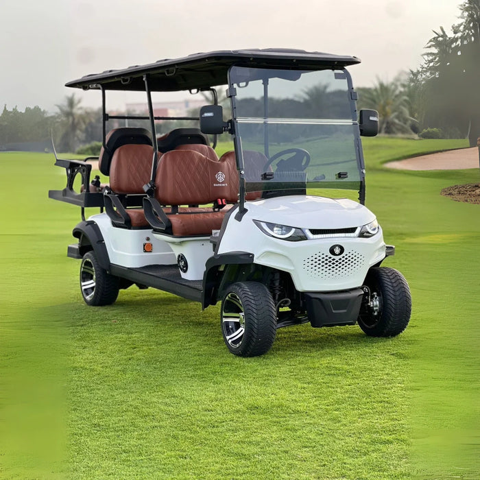 Golf cart on a golf course with green grass and trees in the background
