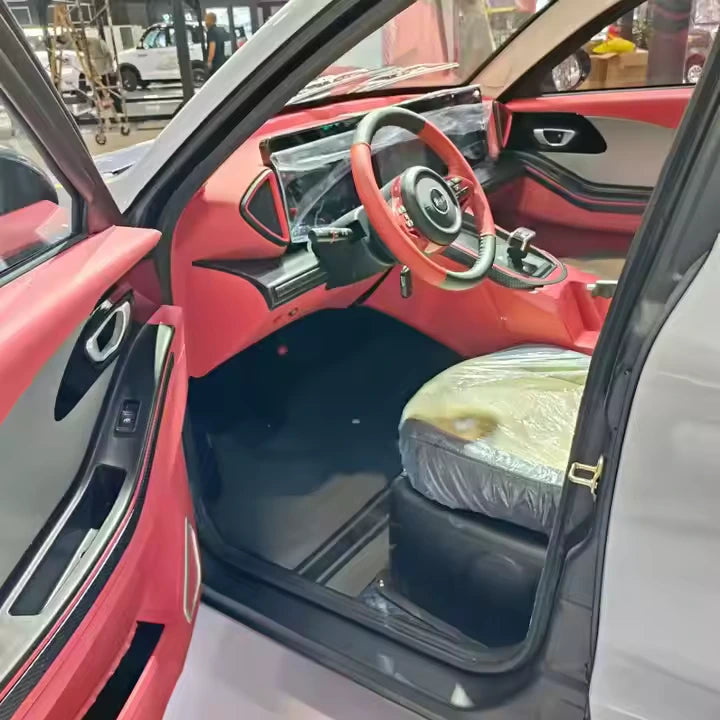 Car interior with a focus on the steering wheel and dashboard.