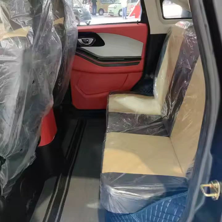 Car interior with beige seats and red door panel, covered with plastic wrap.