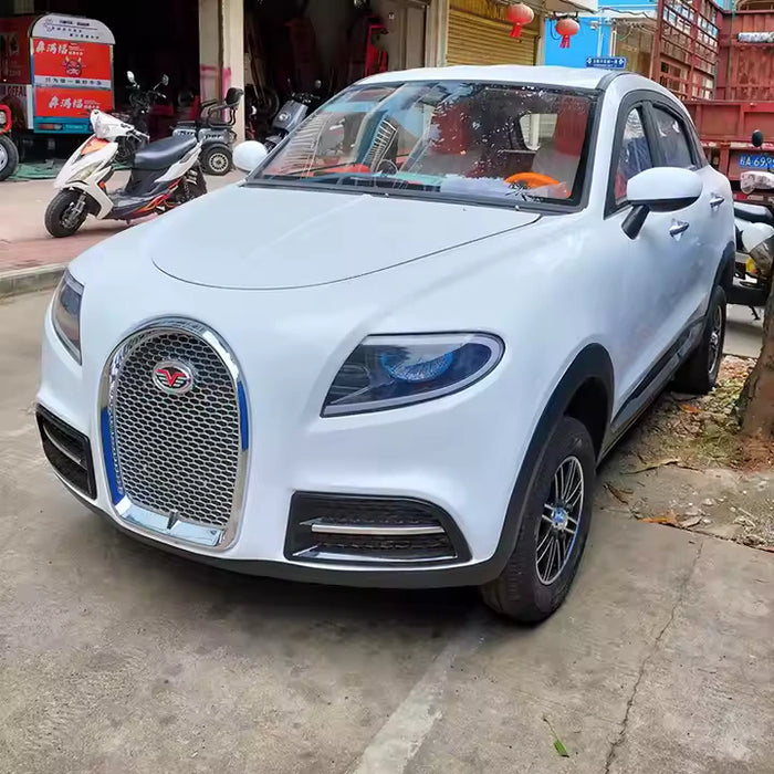 White SUV parked on a street with a scooter and building in the background