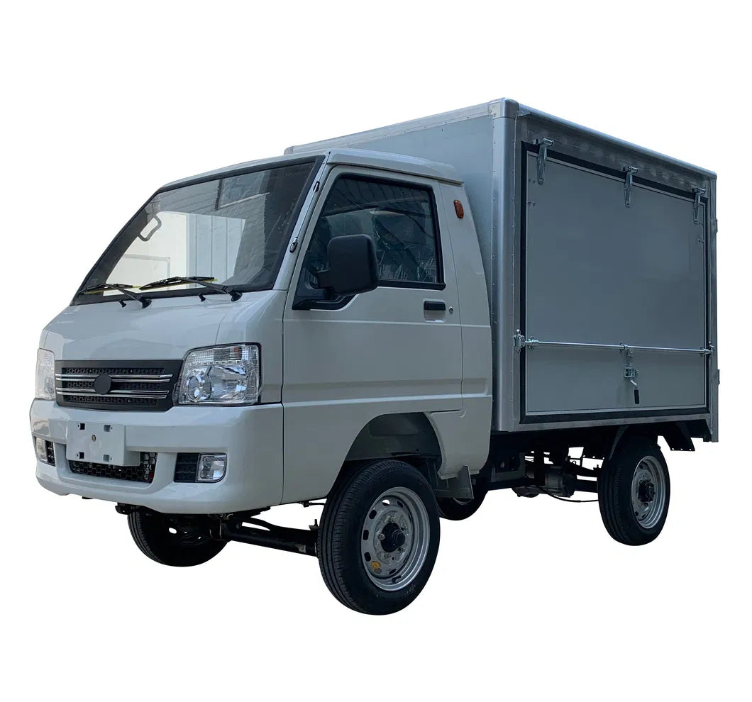 ocean cartz three-quarter front studio shot of a white electric box truck with a single cab and an enclosed, silver aluminum cargo box, set against a pure white background. This electric commercial utility vehicle is a compact electric mini truck or delivery van designed for efficient logistics and urban delivery. It features a modern front end and small utility-style wheels.