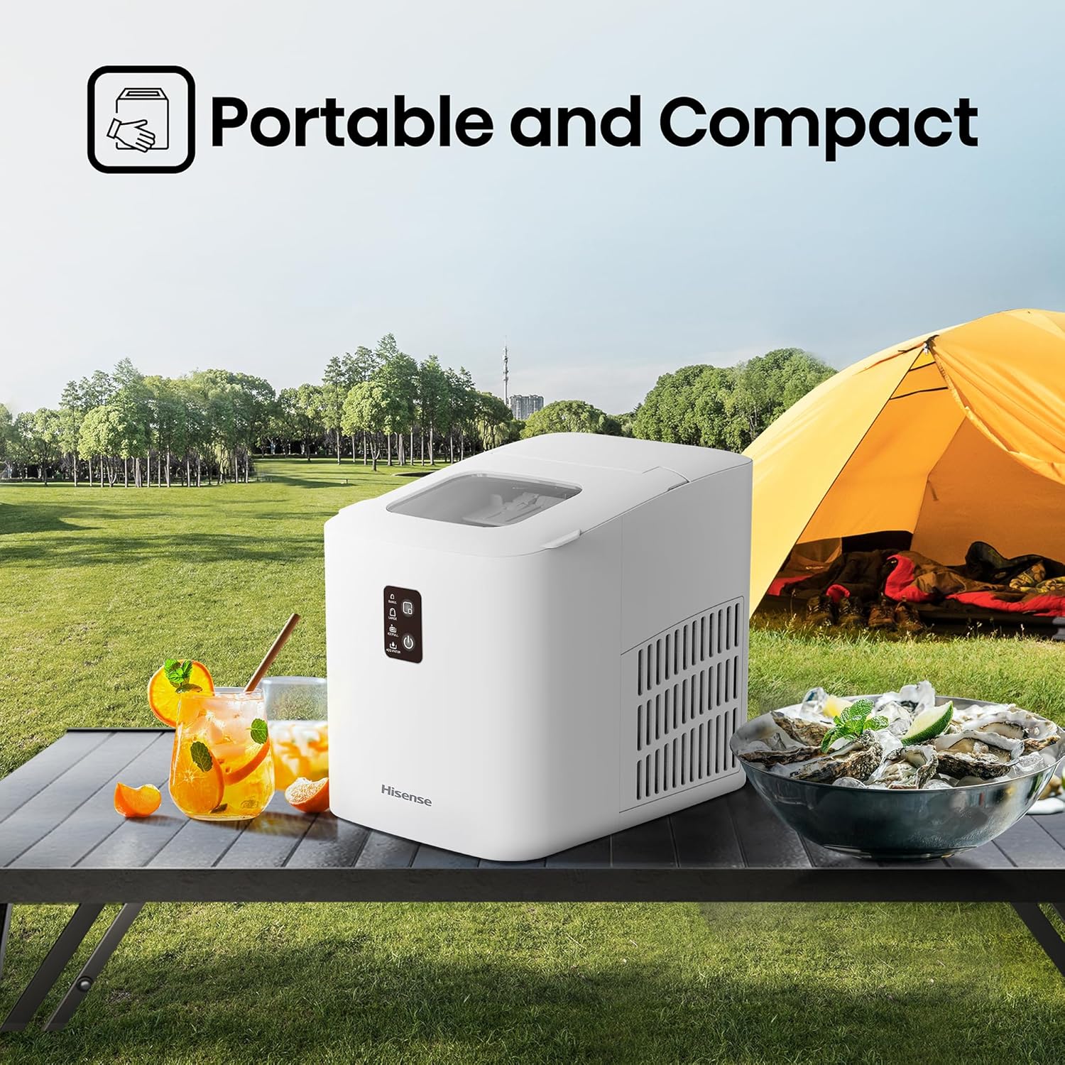 Portable ice maker on a picnic table with a tent and outdoor setting