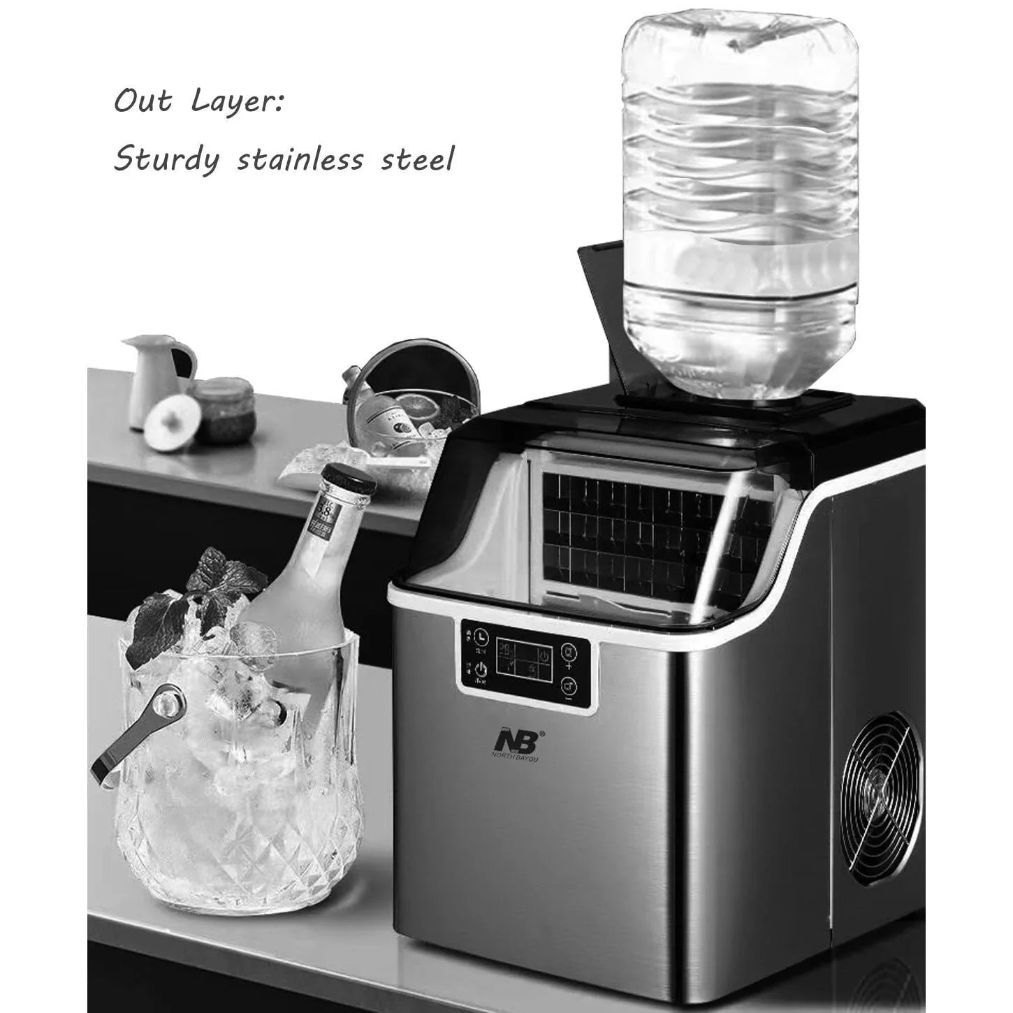 Ice maker on a kitchen counter with a bottle of wine and ice bucket.