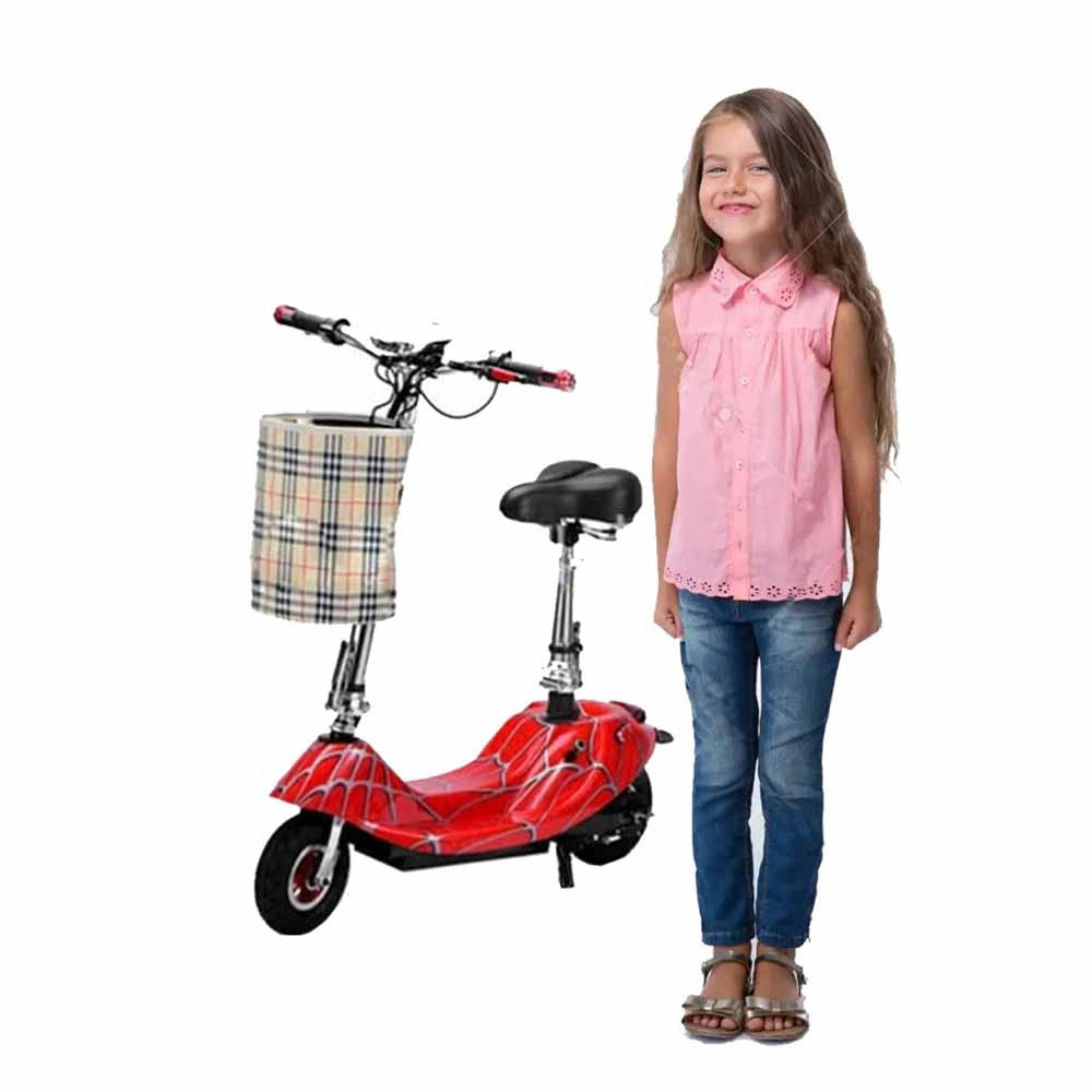 Red scooter with plaid basket next to a girl wearing a pink shirt and blue jeans on a white background