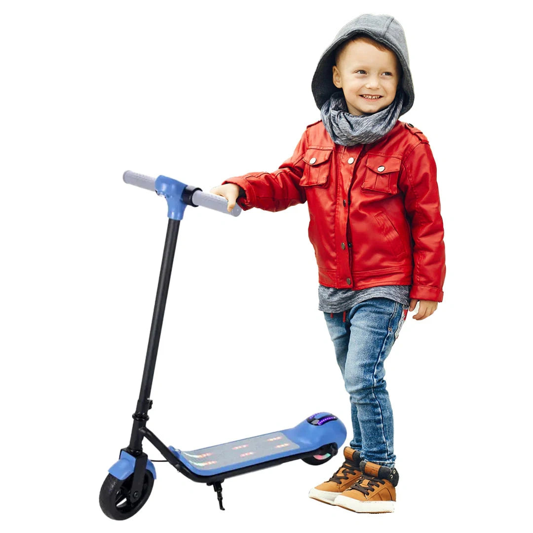 Child in a red jacket standing next to a blue scooter on a white background