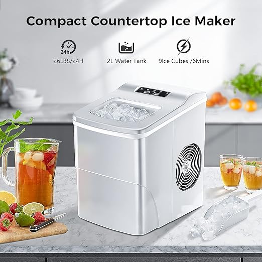 Compact countertop ice maker on a kitchen counter with drinks and fruits.