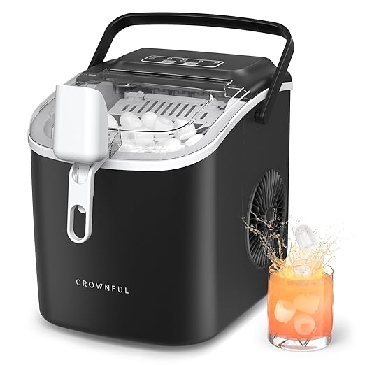 Black ice maker with a glass of orange juice and ice cubes on a white background