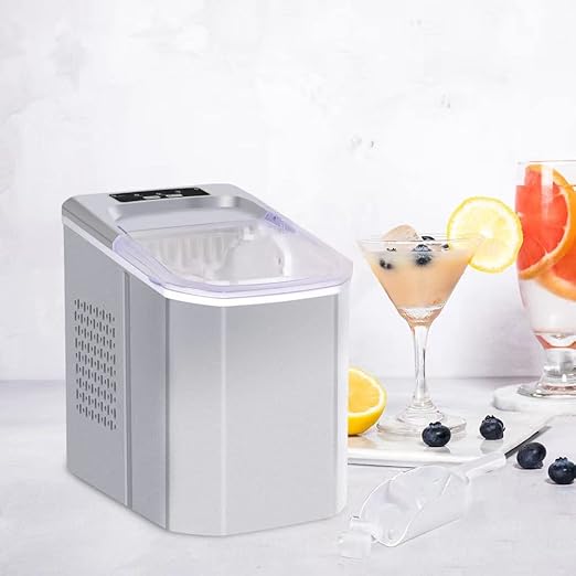 Portable ice maker with two cocktails and fruit on a white background