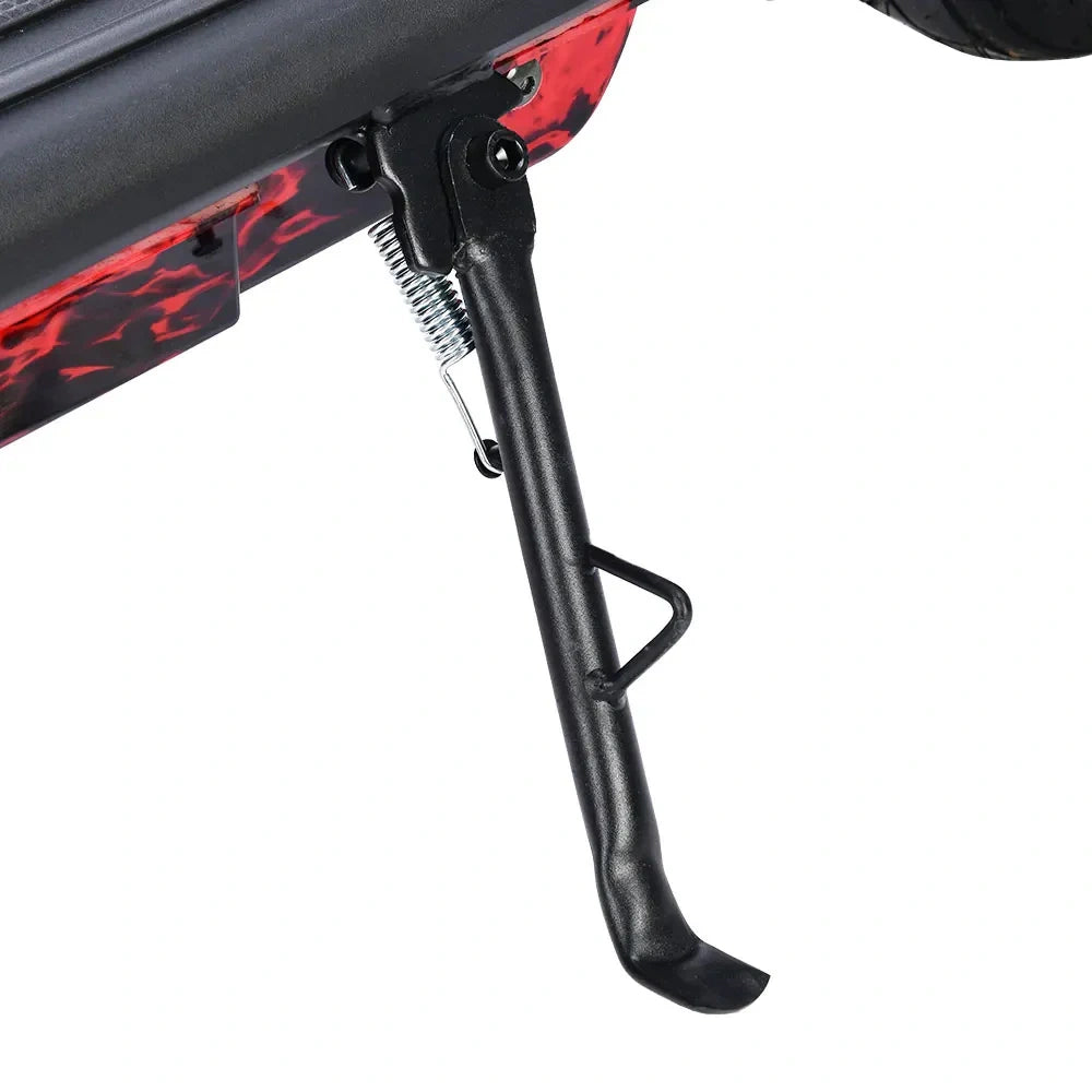 Black motorcycle foot peg with red flame design on a white background