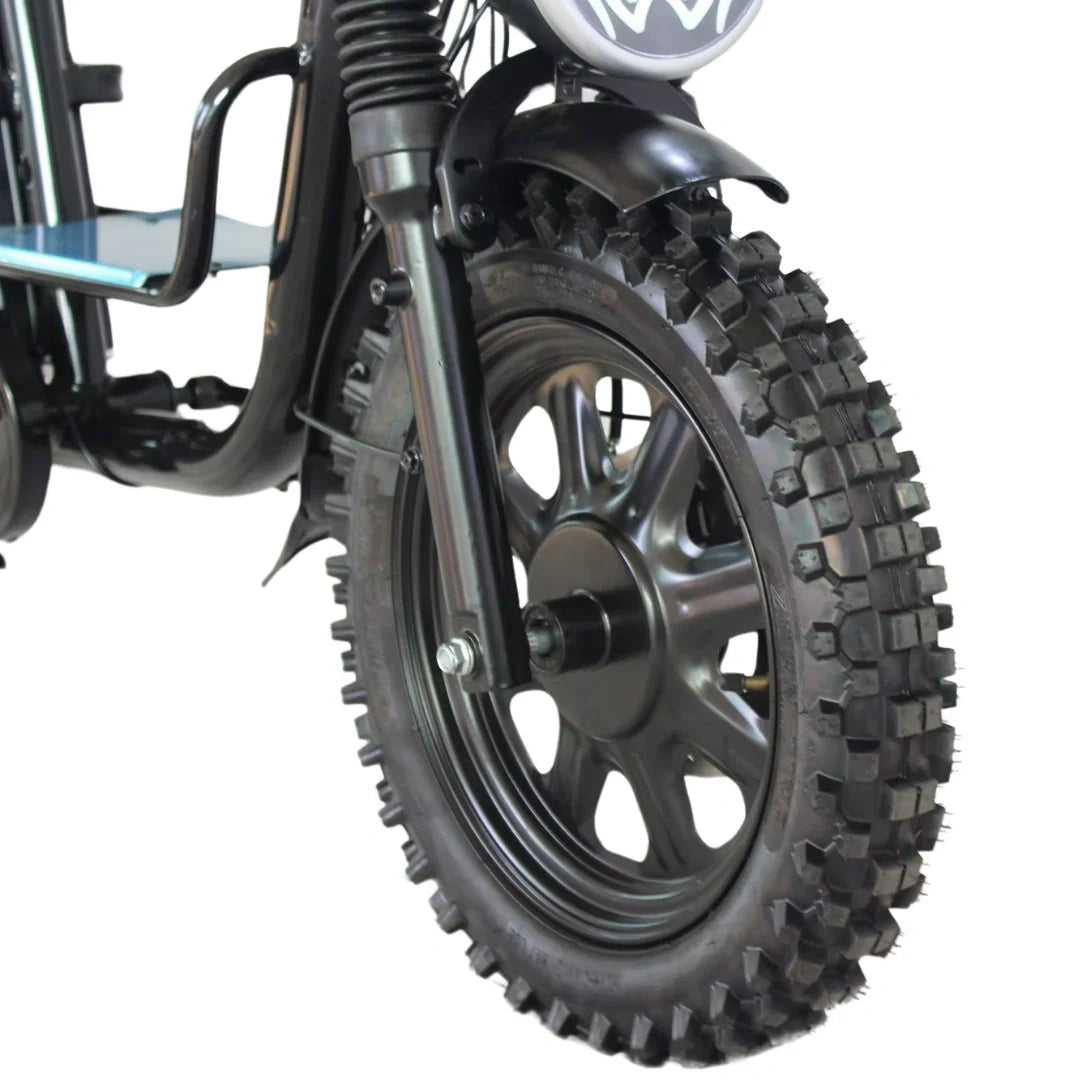 Close-up of a motorcycle tire with knobby tread pattern on a white background
