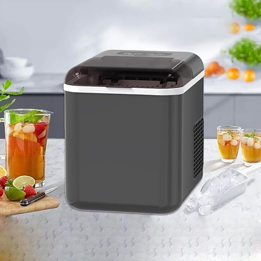 Portable ice maker on a kitchen counter with drinks and snacks.