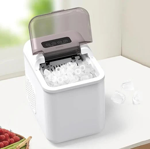 Portable ice maker with a container of ice on a kitchen counter.
